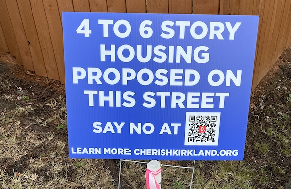 A sign with the slogan: 4 to 6 Story Housing Proposed on This Street - Say No